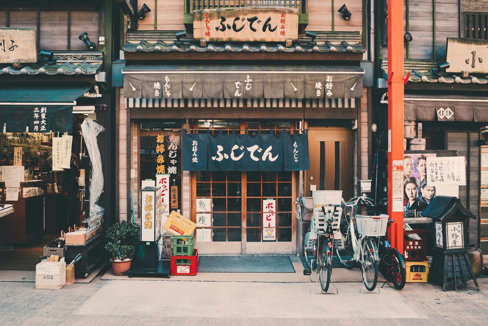 Japanese yen banknotes and coins fanned out on a konbini counter — cash is still king at small shrines and old-school shops