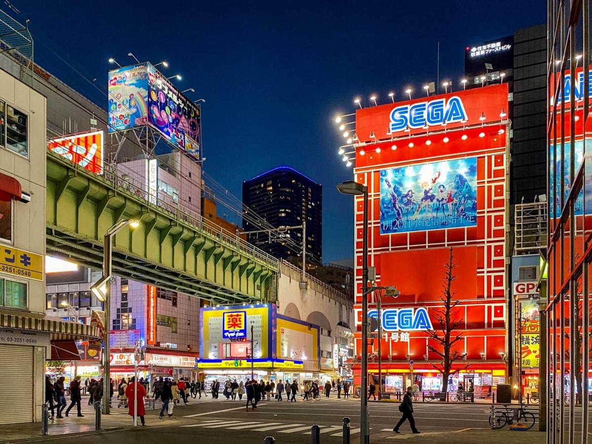 Akihabara Electric Town street with anime shops and neon signs 2026